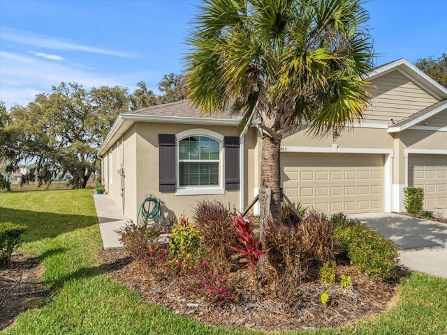 view of home's exterior with a garage, driveway, a lawn, and stucco siding