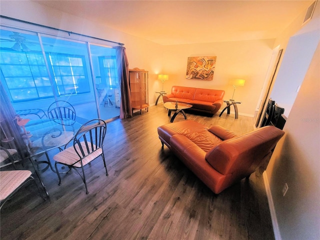 interior space with baseboards and wood finished floors