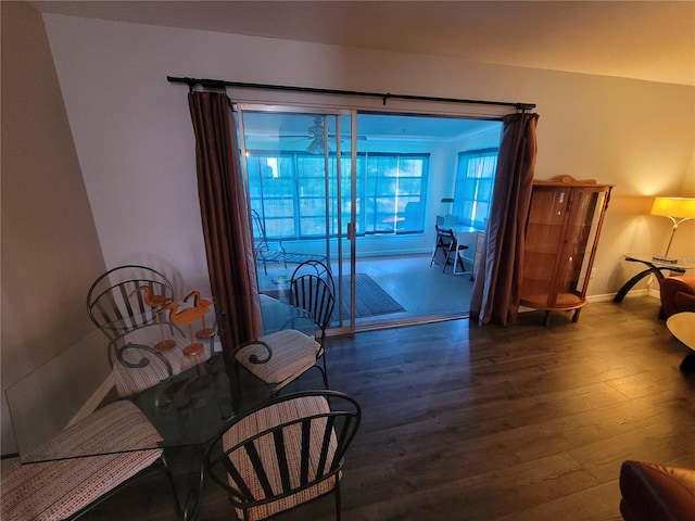 living area featuring wood finished floors and baseboards