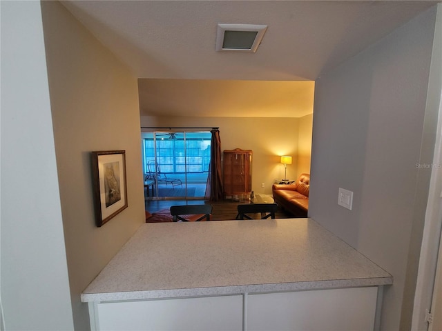 kitchen featuring light countertops and white cabinetry