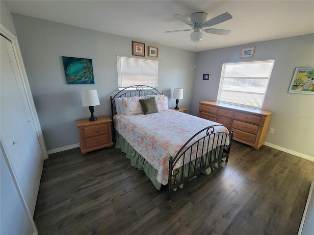 bedroom with dark wood-style floors, baseboards, and a ceiling fan