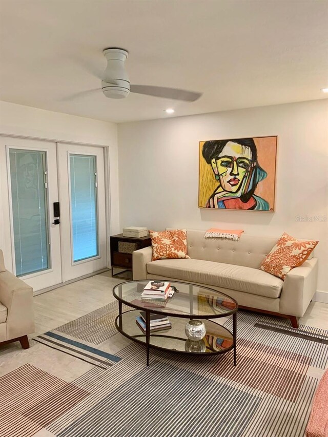 living room featuring recessed lighting, french doors, ceiling fan, and light wood-style flooring