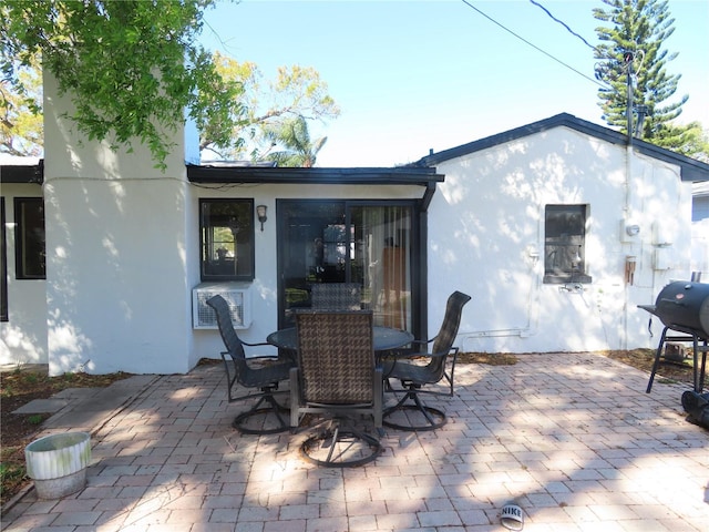 view of patio with outdoor dining area and area for grilling