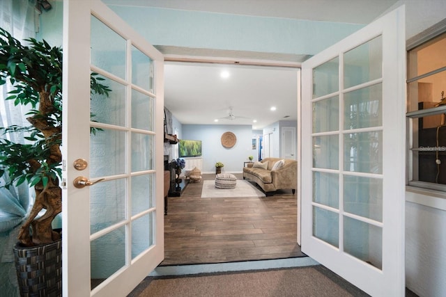 doorway featuring french doors, wood finished floors, a ceiling fan, and recessed lighting