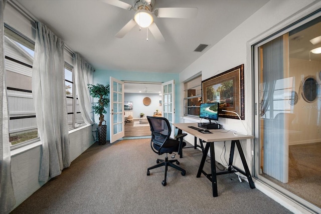 carpeted home office featuring a ceiling fan, french doors, and visible vents