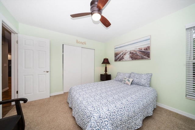 bedroom featuring a closet, carpet flooring, ceiling fan, and baseboards