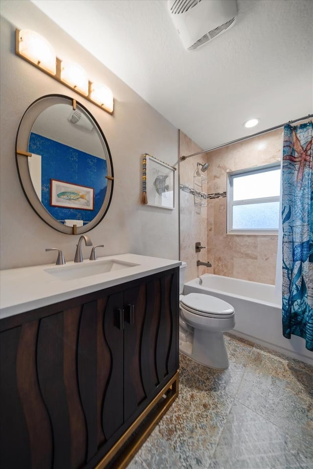 bathroom with toilet, vanity, shower / bath combo with shower curtain, and visible vents