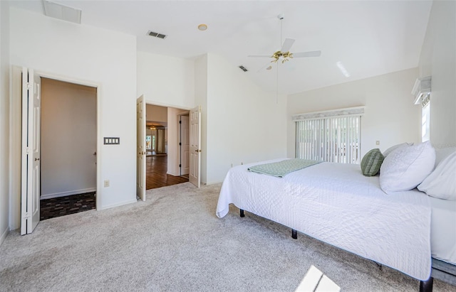 carpeted bedroom with visible vents, high vaulted ceiling, and ceiling fan