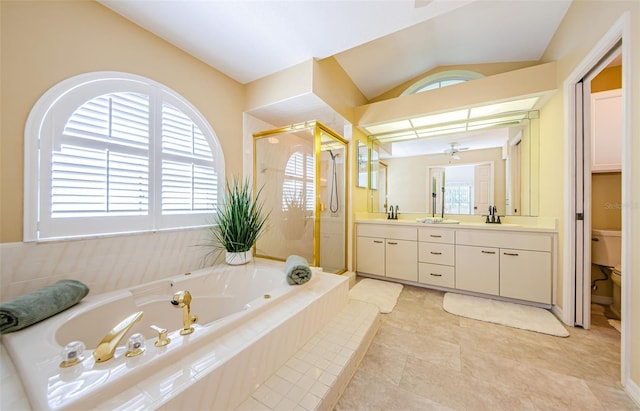 bathroom with toilet, double vanity, a whirlpool tub, vaulted ceiling, and a stall shower