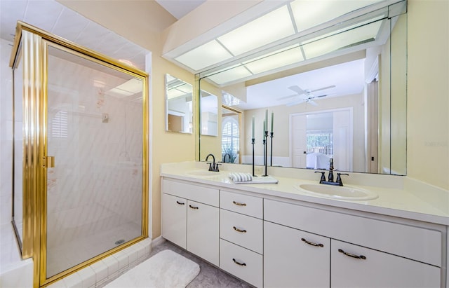 full bath featuring a shower stall, double vanity, ensuite bathroom, and a sink