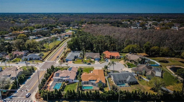 aerial view featuring a view of trees and a residential view