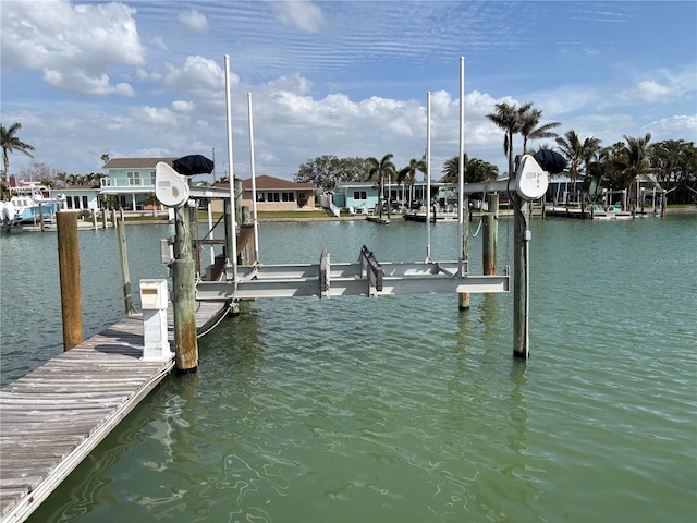 view of dock featuring a water view and boat lift