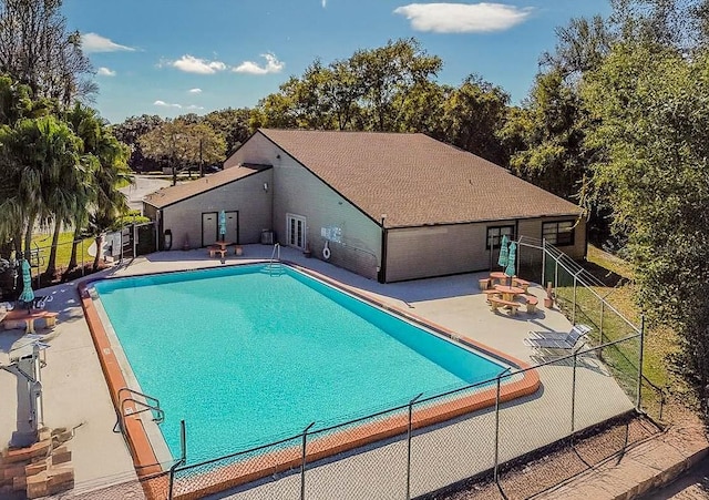 pool featuring a patio area and fence