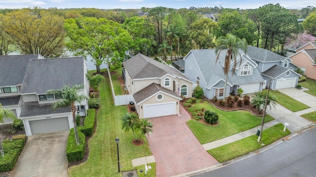 birds eye view of property with a residential view