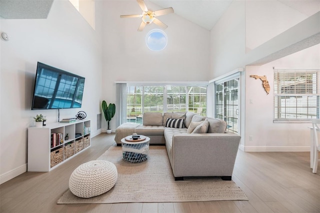 living area featuring wood finished floors and baseboards