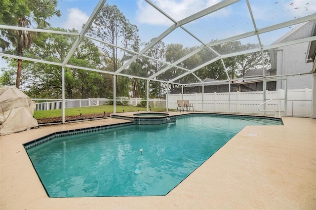 view of swimming pool with a lanai, a patio area, a fenced backyard, and a pool with connected hot tub