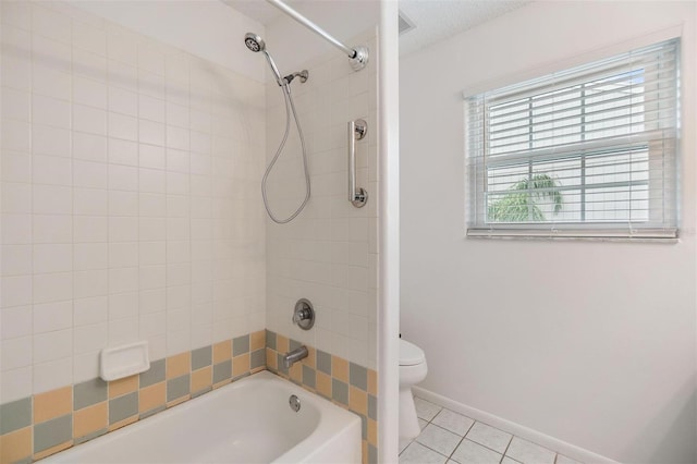 full bathroom featuring shower / washtub combination, tile patterned flooring, baseboards, and toilet