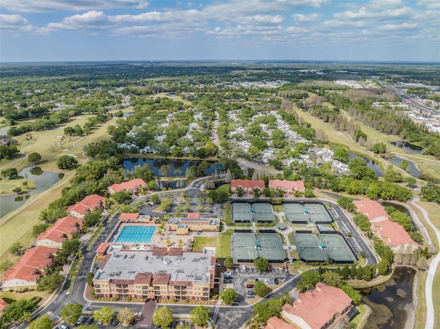 birds eye view of property featuring a water view and view of golf course