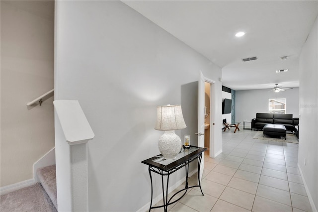 1773 Yellow Trl, Lakeland, FL 33801 - hall featuring light tile patterned floors, stairway, visible vents, and baseboards