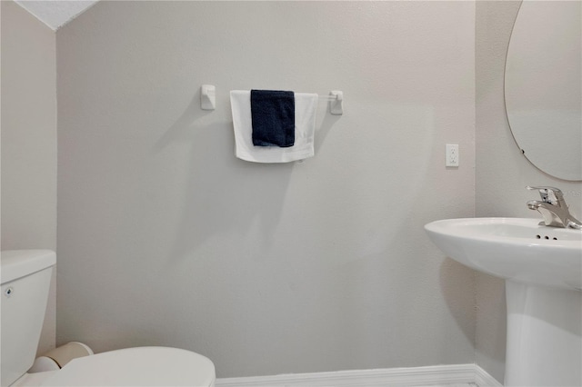 1773 Yellow Trl, Lakeland, FL 33801 - bathroom with toilet, baseboards, and a sink