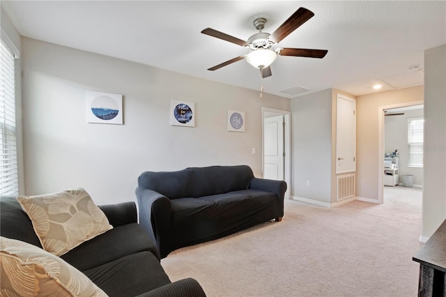 1773 Yellow Trl, Lakeland, FL 33801 - living room featuring attic access, visible vents, baseboards, a ceiling fan, and light colored carpet