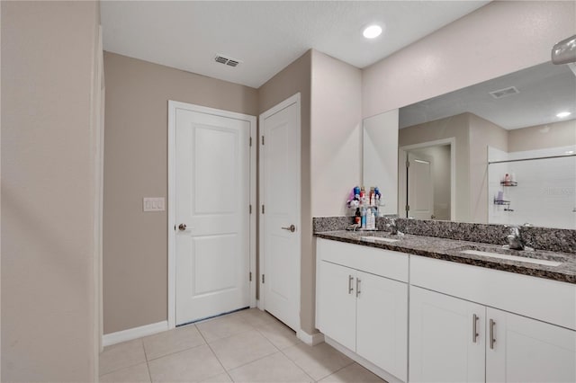 1773 Yellow Trl, Lakeland, FL 33801 - bathroom featuring tile patterned flooring, a shower stall, visible vents, and a sink