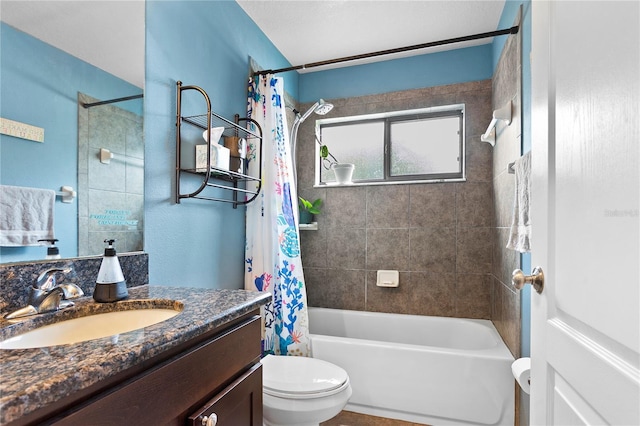 full bathroom featuring shower / bathtub combination with curtain, vanity, and toilet