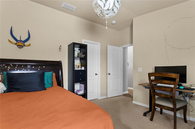 bedroom with carpet floors, visible vents, and baseboards