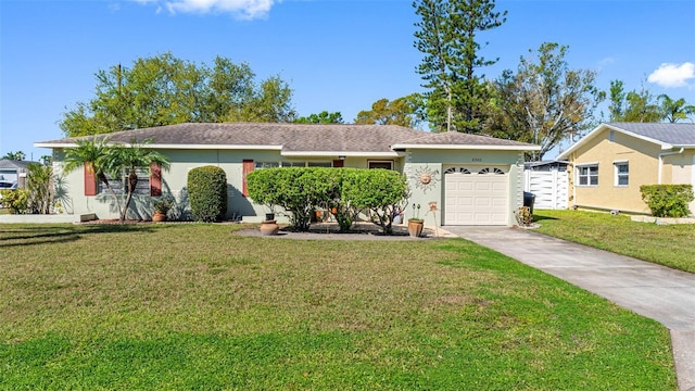 ranch-style home featuring a garage, a front yard, driveway, and stucco siding