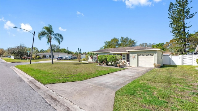 single story home with a garage, fence, driveway, a gate, and a front yard