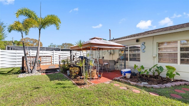 view of yard featuring a gazebo and fence