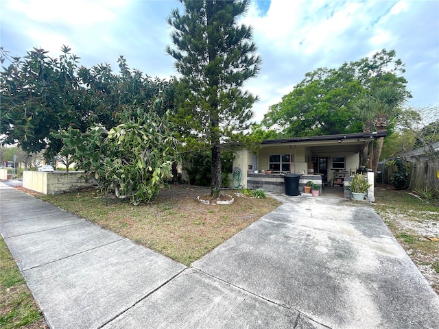 single story home featuring fence