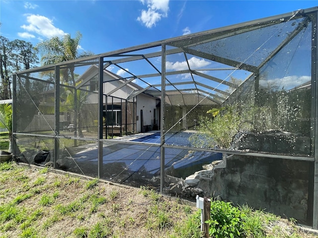 view of swimming pool with a lanai