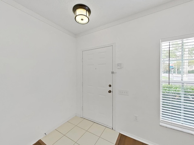 foyer entrance with baseboards