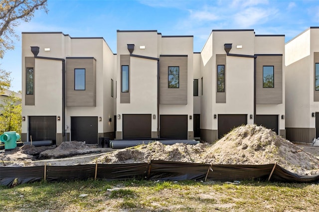 view of front of home featuring stucco siding and an attached garage