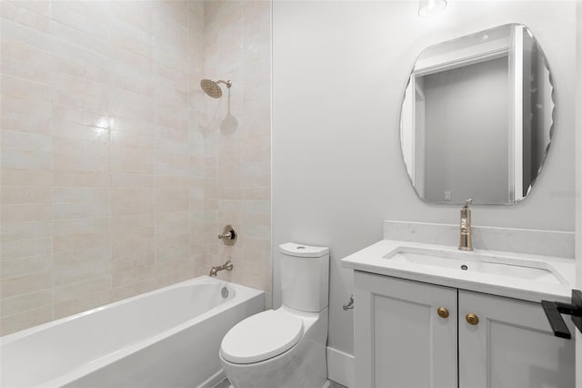 bathroom featuring bathing tub / shower combination, vanity, and toilet