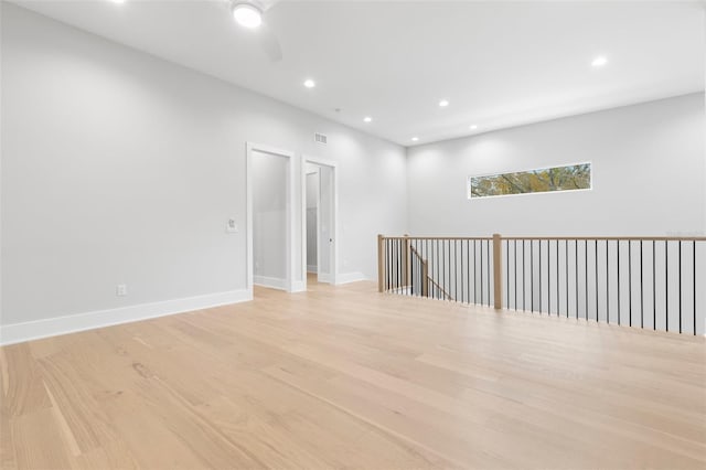 unfurnished room with visible vents, baseboards, ceiling fan, light wood-style floors, and recessed lighting