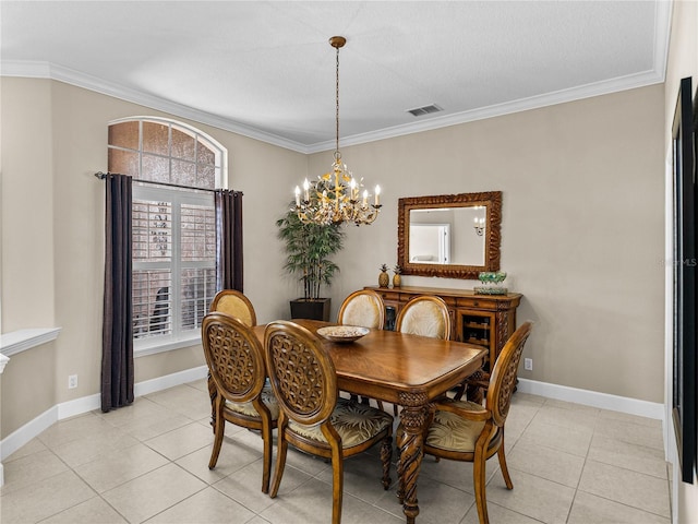 dining space featuring baseboards, visible vents, and ornamental molding