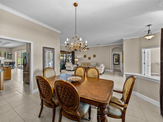 dining room with crown molding, plenty of natural light, baseboards, and light tile patterned floors