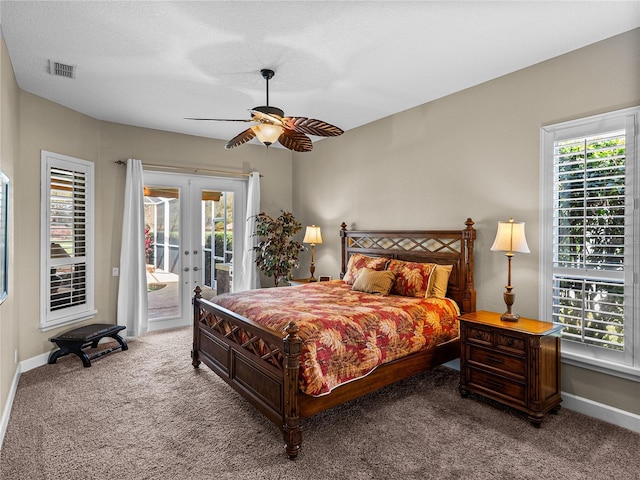 bedroom featuring french doors, multiple windows, visible vents, and access to exterior