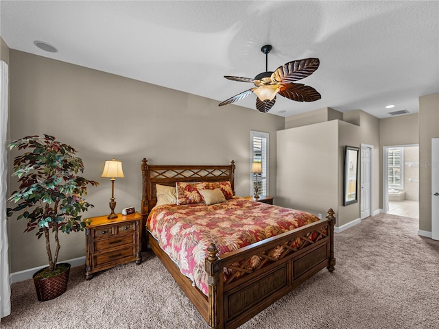 bedroom with visible vents, baseboards, light colored carpet, ceiling fan, and a textured ceiling