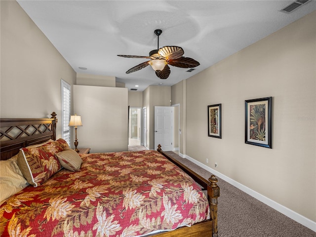 bedroom with ceiling fan, carpet, visible vents, and baseboards