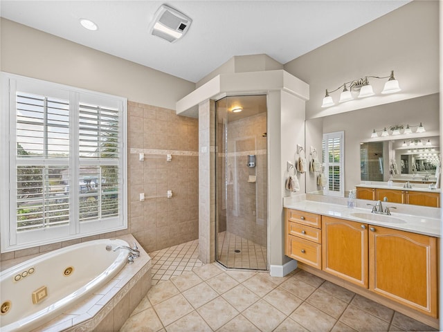 full bath featuring visible vents, tile patterned floors, a whirlpool tub, a tile shower, and vanity