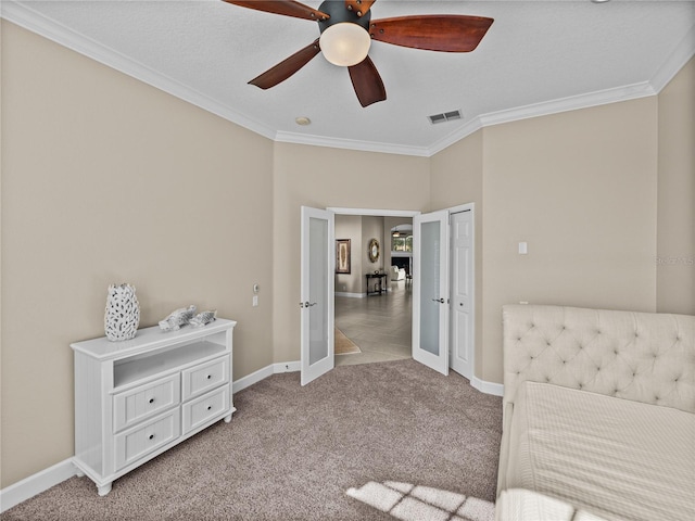 bedroom with light carpet, french doors, visible vents, and crown molding