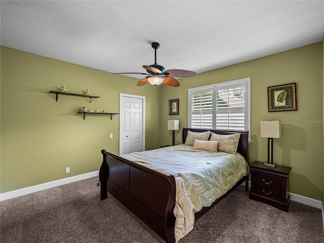 bedroom featuring carpet, baseboards, ceiling fan, and a textured ceiling