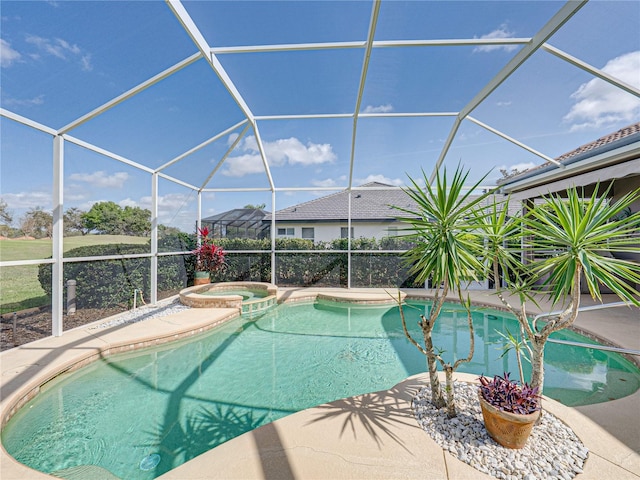 view of swimming pool with a lanai, a patio area, and a pool with connected hot tub