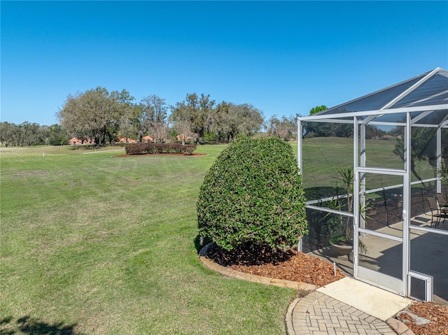 view of yard with glass enclosure