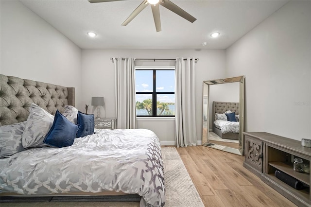 bedroom featuring ceiling fan, light wood-style flooring, and recessed lighting