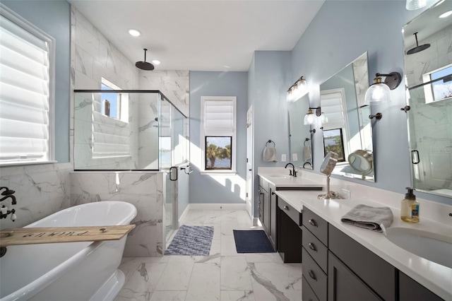 full bathroom featuring marble finish floor, double vanity, a stall shower, and a soaking tub