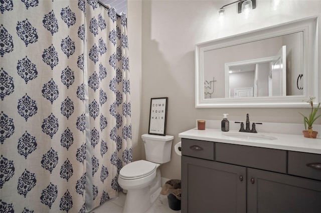 bathroom with toilet, curtained shower, and vanity